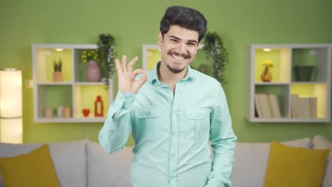 Cheerful-and-happy-young-man-looks-at-camera-with-positive-gestures.